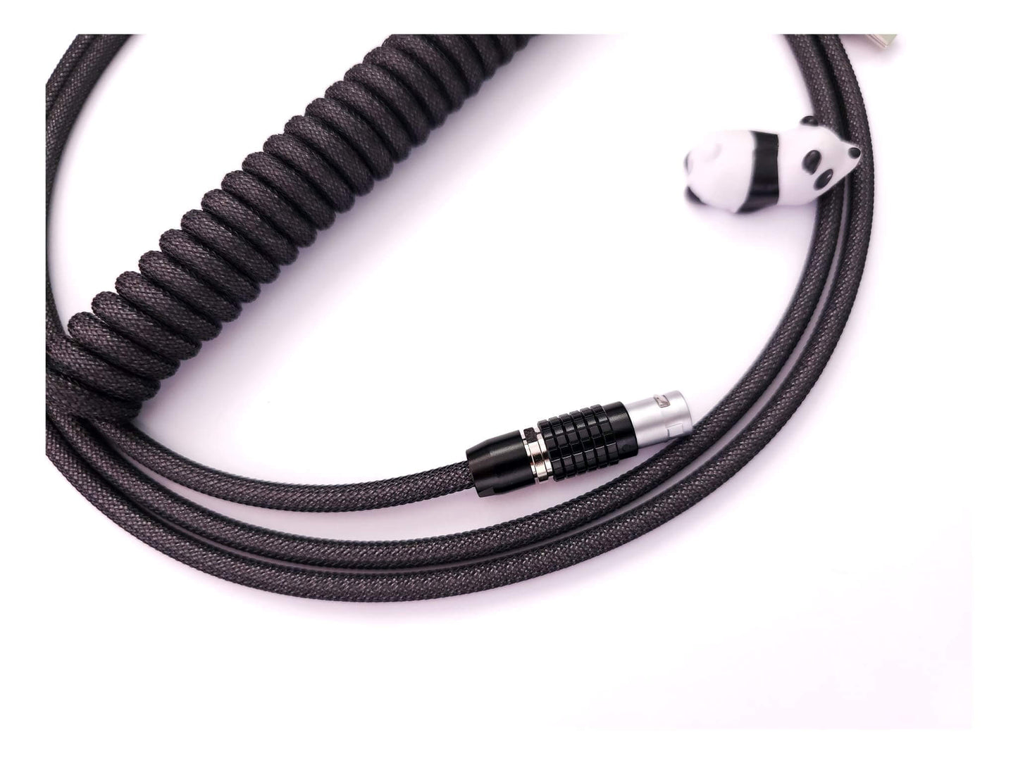 Black Lemo connector on dark grey coiled cable
