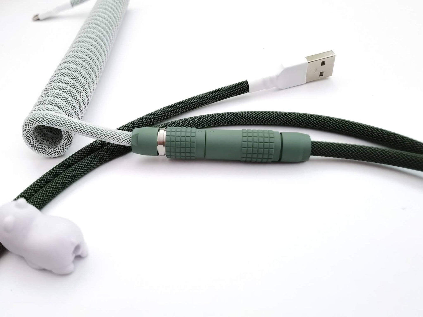 Matching GMK Botanical v2 keycaps keyboard cable, with forest green Lemo connector and white heat-shrink.