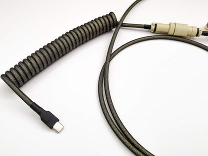 Beige keyboard cable with Aviator connector and blakc USB C connection