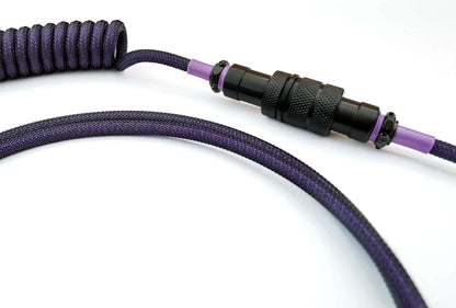 Black Aviator Gx16 connector on purple coil cable