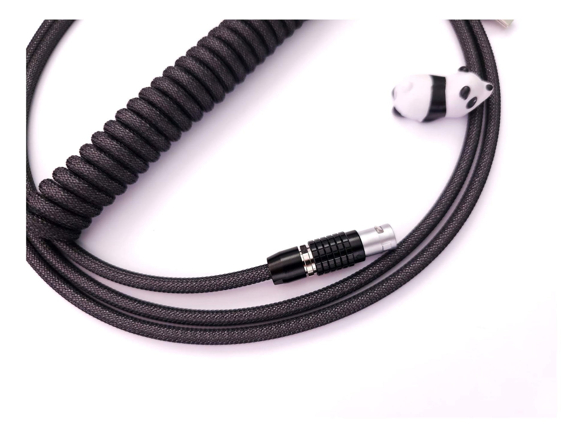 Black Lemo connector on dark grey coiled cable