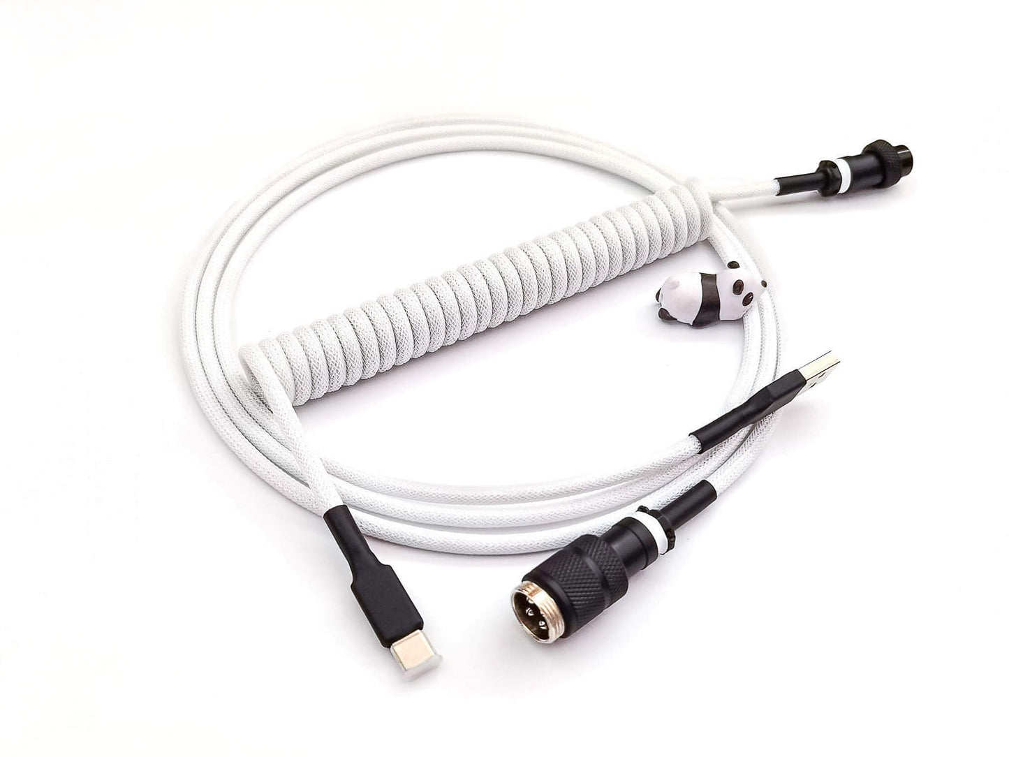 Black and white coiled cable with white coil, black Gx16 connector, black heat shrink and USB C connection and black panda cable bite
