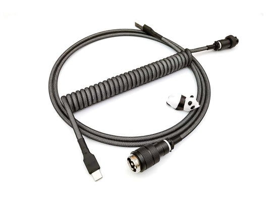 Coiled cable in Black on white, with black Gx16 connector, black heat-shrink and USB-C connection with panda cable bite