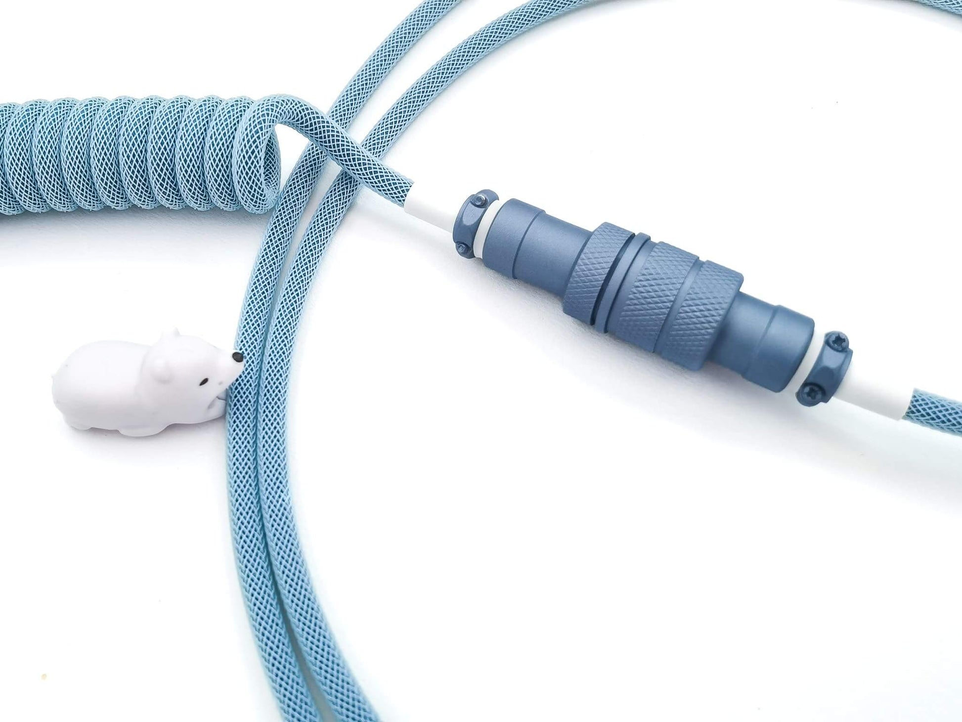 Gx16 Aviator connector painted in polar Blue color on blue coil cable with white animal cable bite