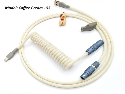 Light beige keyboard cable with Lemo connector painted in polar blue and grey heat-shrink.