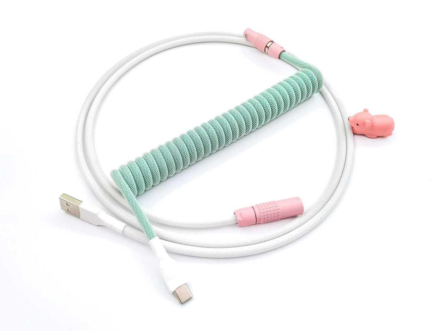 Coiled keyboard cable designed DSA Magic Girl keycaps with pastel green coil, pink Lemo connector and white host cable and pink bear cable bite