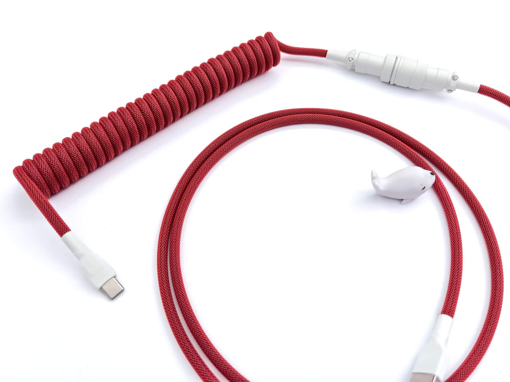 Coiled keyboard cable for red keycaps and red mechanical keyboards.