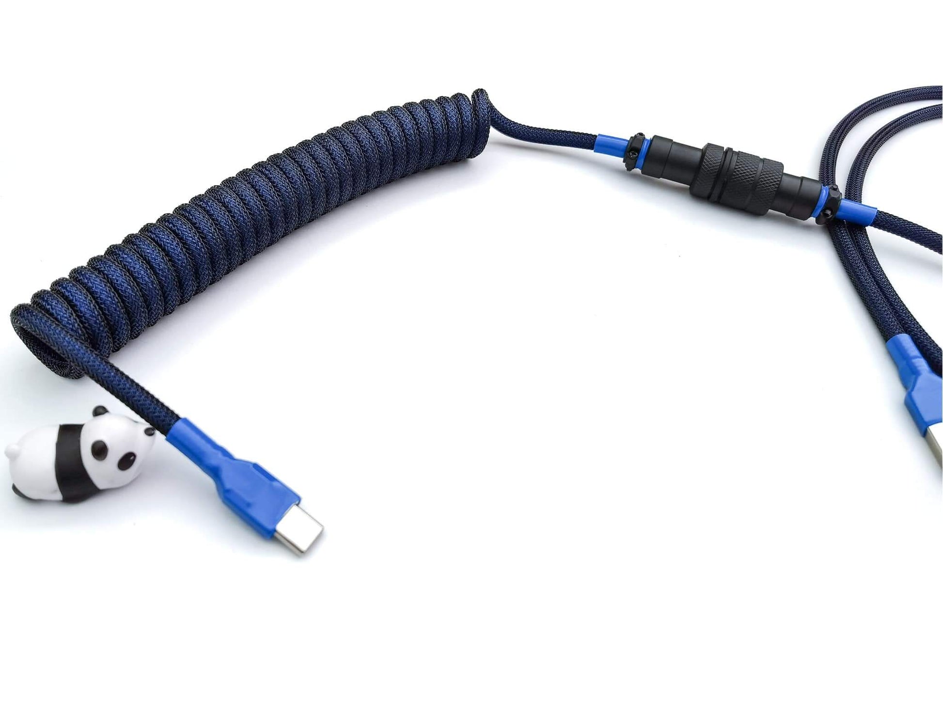 Dark blue coiled keyboard cable for mechanical keyboard with black aviator, blue heat shrink and USB c connection and a panda cable bite