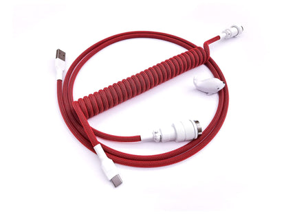 Coiled cable in red to match GMK Jamon keycaps. With white Gx16 aviator connector and white heat-shrink.