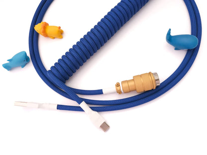 Blue keyboard cable matching GMK Lazurite keycaps with USB C to A connection and gold Aviator connector and blue cable bite protector