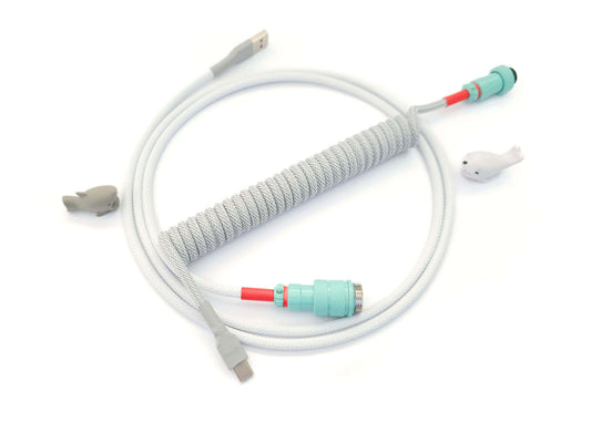Coiled keyboard cable designed to match GMK Modern Dolch light keycaps with teal Gx16 connector and gray heat shrink
