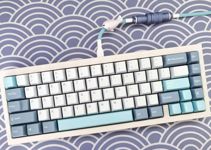 Custom Aviator cable for GMK Shoko keycaps. With polar blue Gx16 and white heat-shrink on a mechanical keyboard with GMK Shoko keycaps.