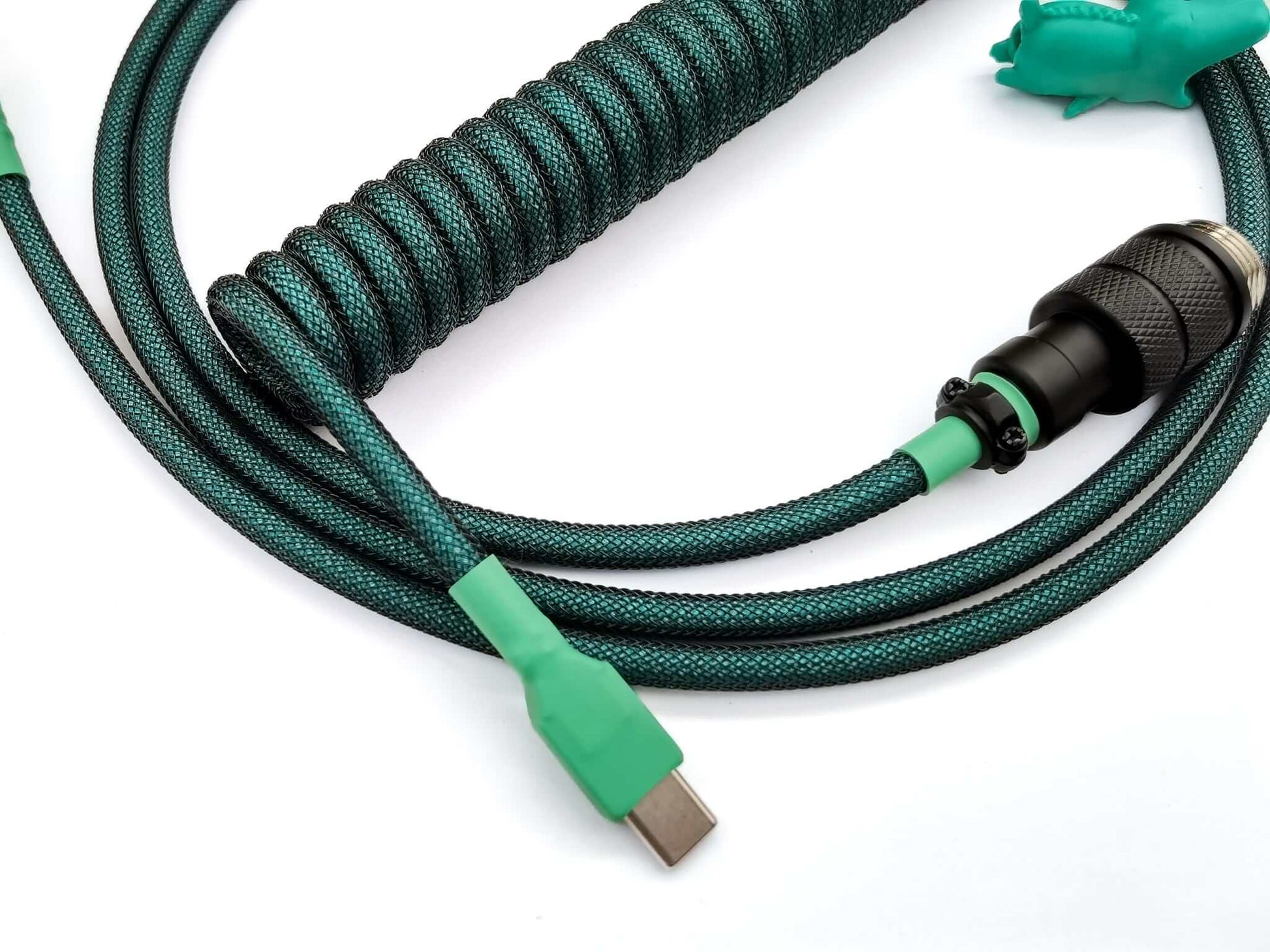 Teal keyboard cable designed for GMK Terror Below keycaps with Aviator and USB C to A connection and a green crocodile cable bite