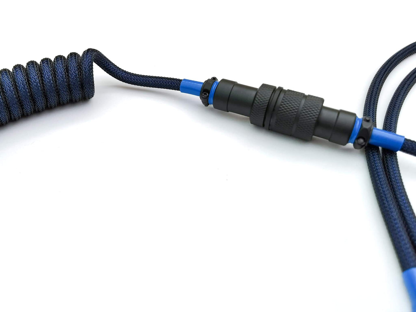 Black Gx16 connector, 4-pin, with blue heat-shrink on a blue coil cable