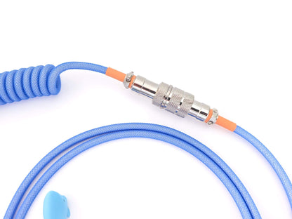 4-pin Gx16 Aviator connector with orange heat shrink on blue coil