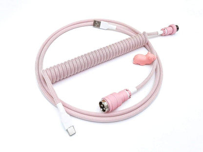 Pastel pink coiled cable with pink Gx16 connector, white heat-shrink and USB C connection, and pink cable bite protector