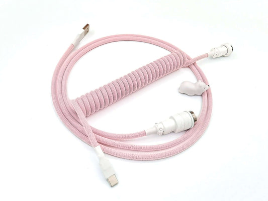 Coiled cable in baby pink colors with white Gx16 connector and white heat-shrink, and white bear cable protector