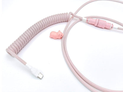 Matching coil cable for pink keycaps and pink mechanical keyboards with white heat-shrink and pink Aviator and pink cable bite