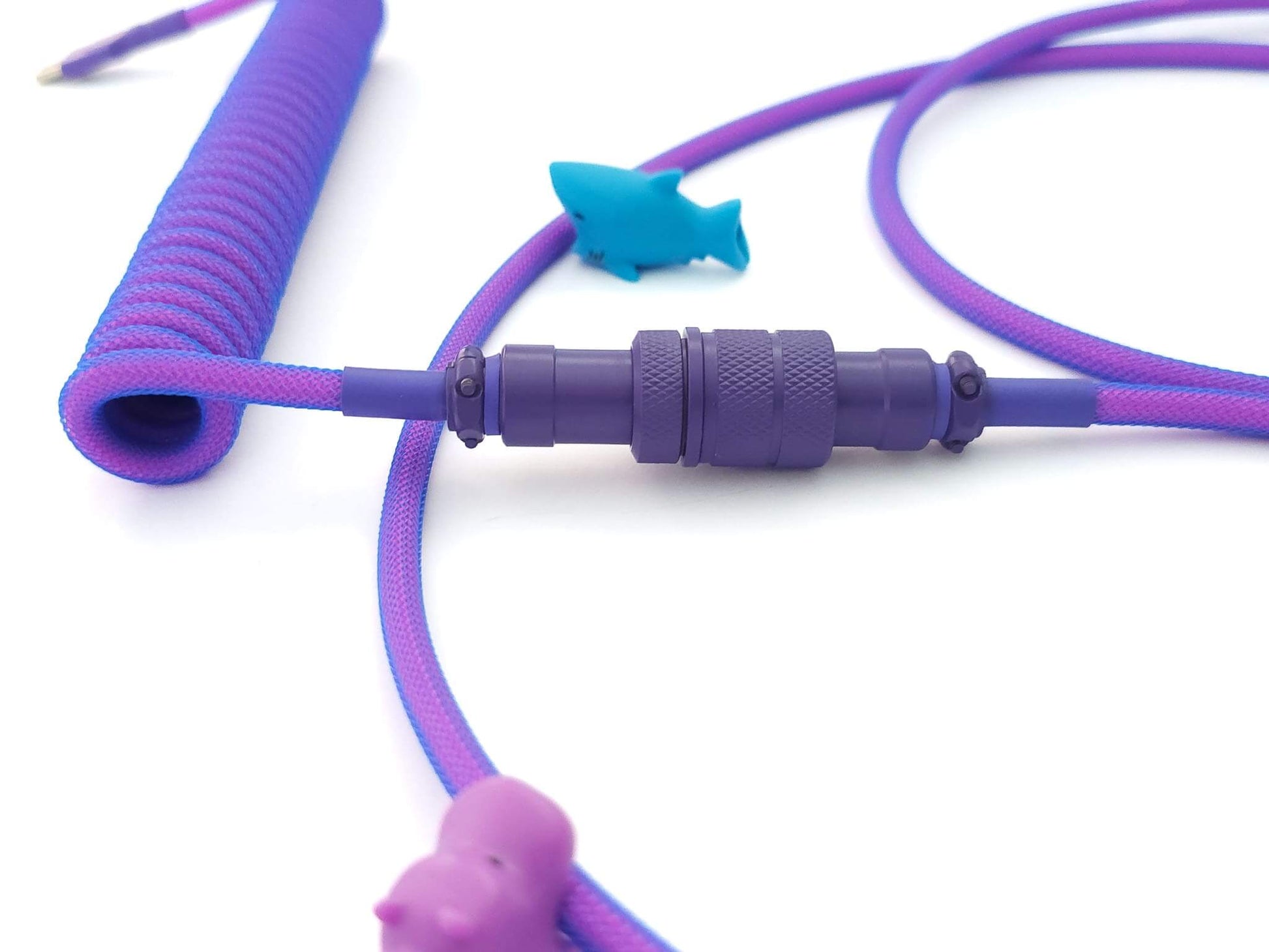 Purple Aviator Gx16 connector on a neon blue coil cable