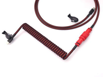 Red coiled keyboard cable for GMK Red Dragon and other red keycaps equipped with USB C to A, red Gx16 Aviator, and black heat-shrink