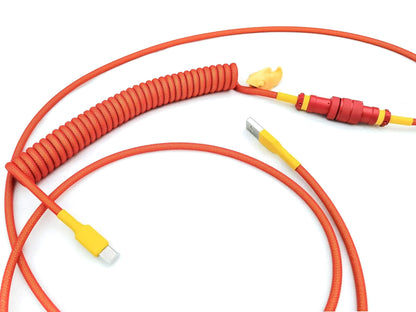 Red coiled usb cable for custom mechanical keyboard with red keycaps.