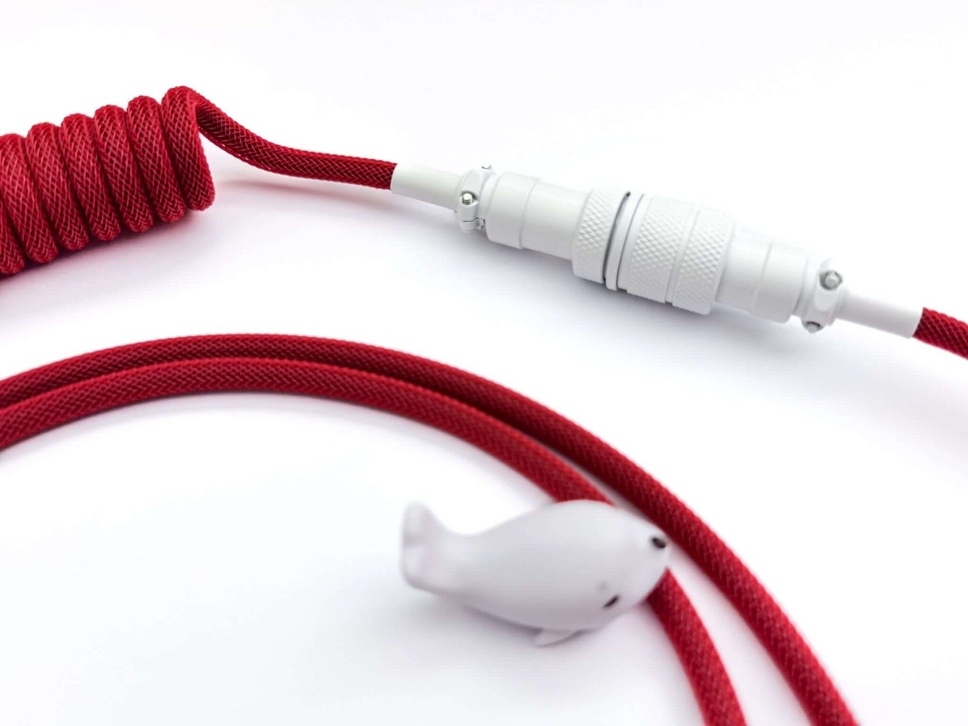 Gx16 connector painted in white on red coil cable with white cable bite protector