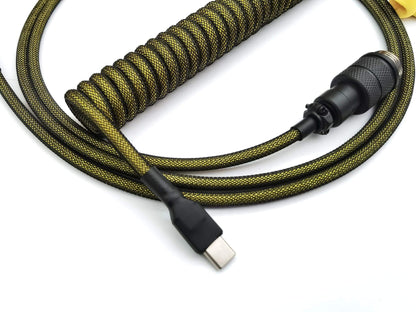 Coiled keyboard cable with black and yellow colors with USB C connection and black heat shrink