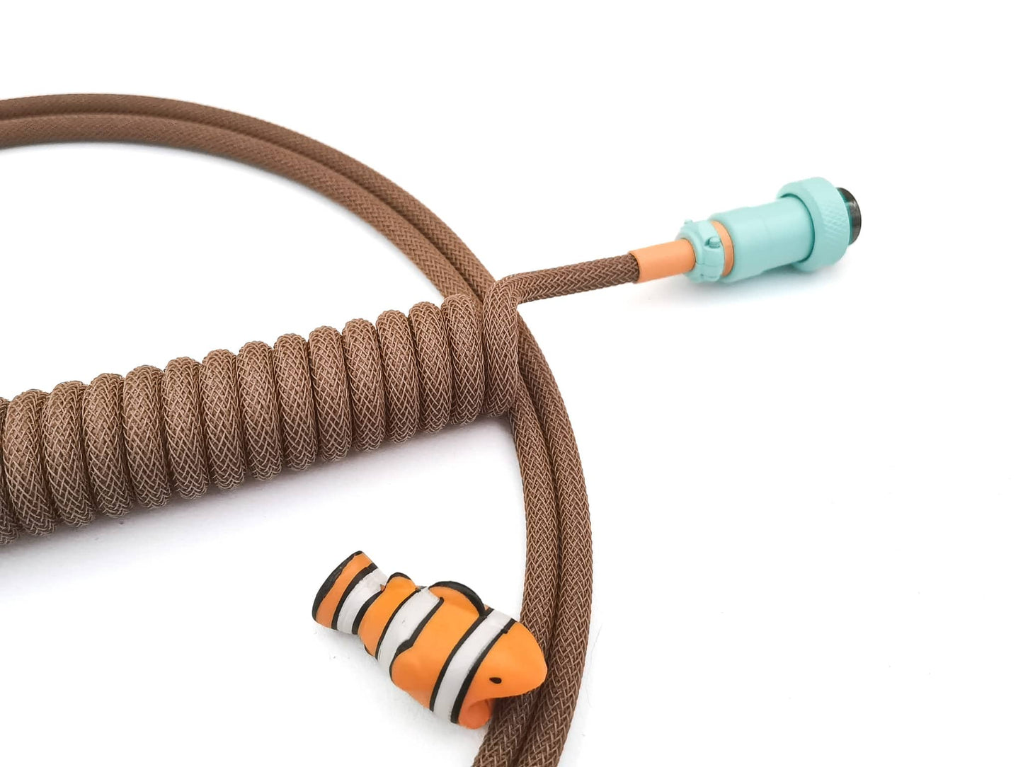 Brown coiled keyboard cable with teal Aviator connector, orange heat-shrink and USB C to A connection.