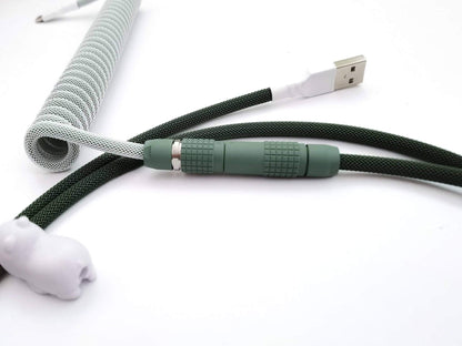 Matching GMK Botanical v2 keycaps keyboard cable, with forest green Lemo connector and white heat-shrink.