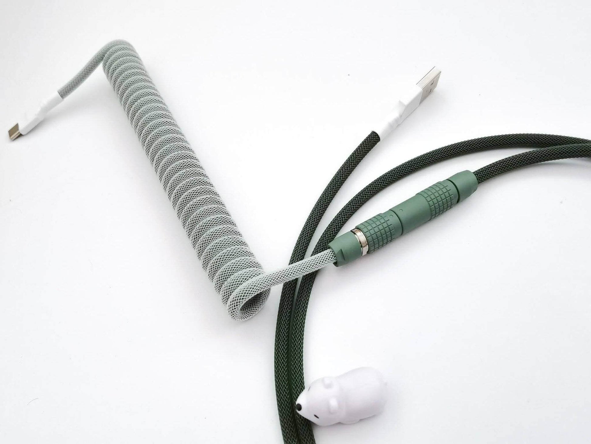Custom keyboard cable for GMK Botanical, with dark green Lemo connector and white heat-shrink.